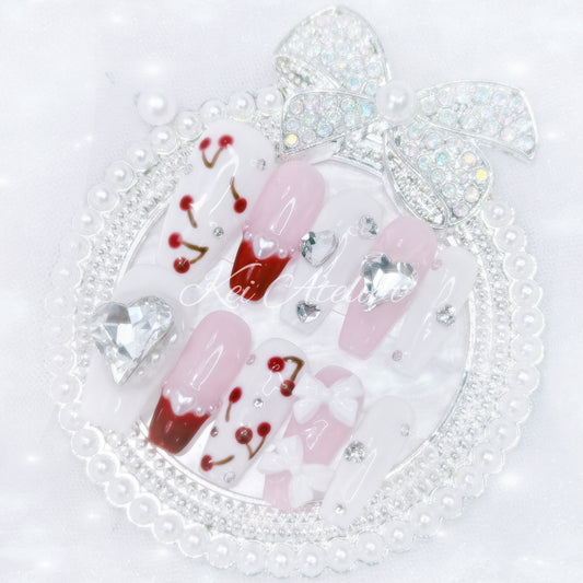 kawaii japanese ryousangata jirai gyaru style handmade press-on nail set featuring pink, white, and cherry red jelly gels, bejeweled in heart crystal rhinestone charms, white bows, pearls, and hand-painted cherries, perfect for summer, bold yet soft