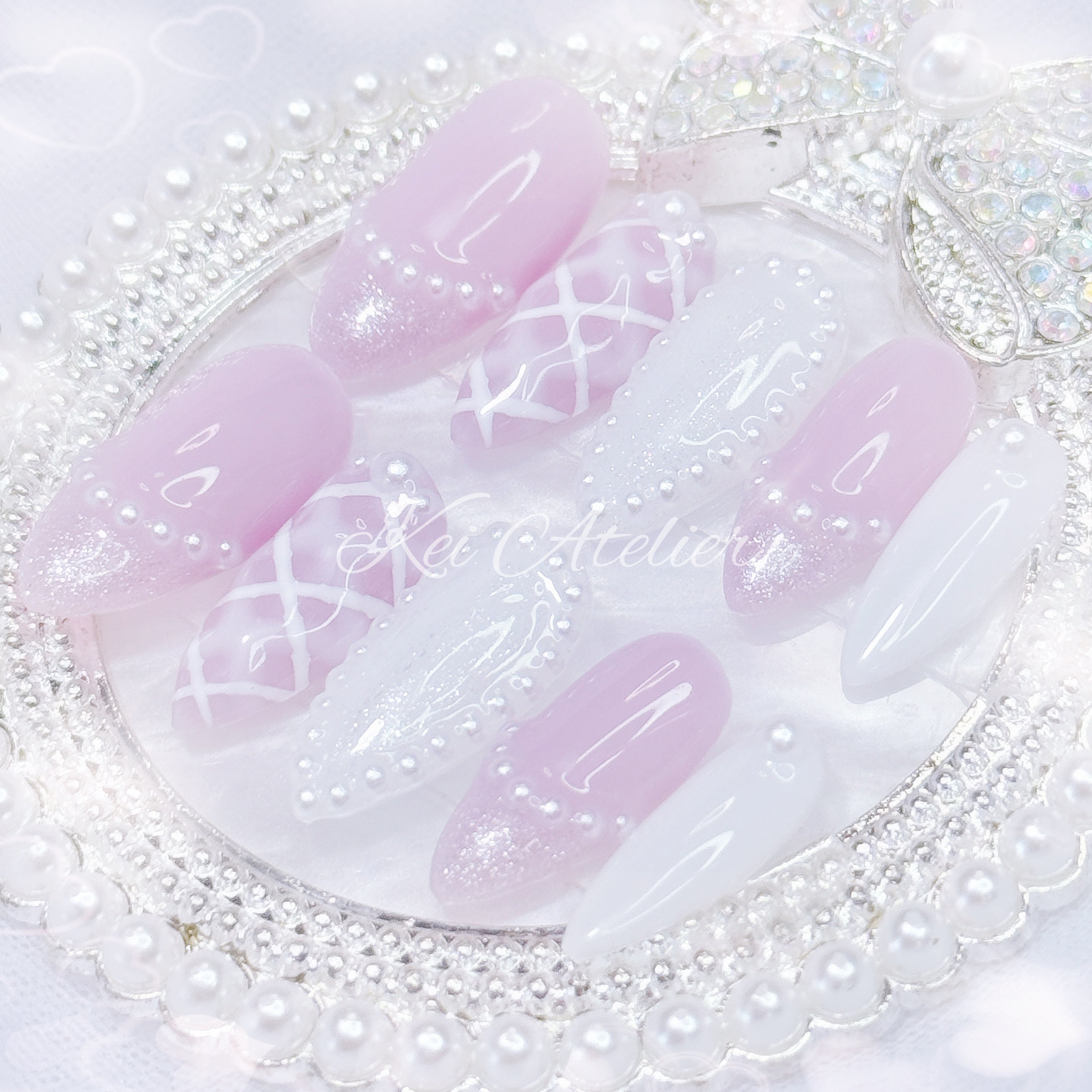 kawaii japanese ryousangata jirai coquette style handmade press-on nail set featuring lavender purple and white gels, a lattice pattern, and pearls lining the french tips and boarders